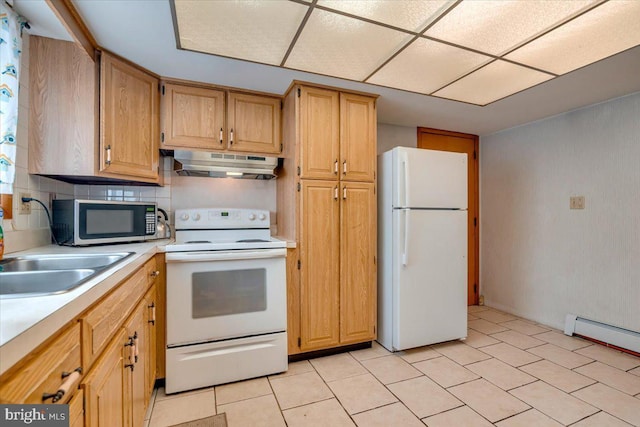 kitchen with backsplash, sink, white appliances, and a baseboard heating unit