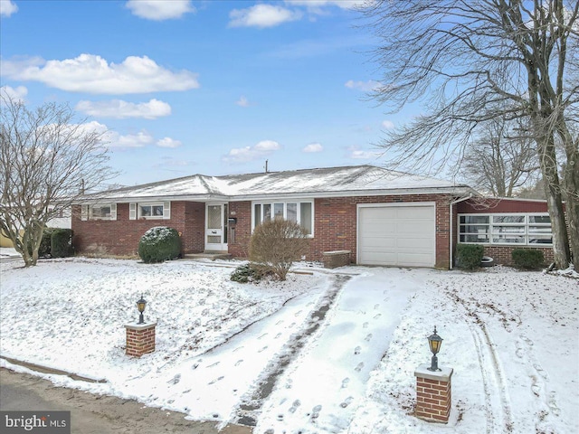 ranch-style home with a garage