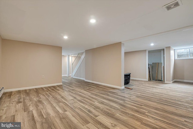 basement featuring light wood-type flooring