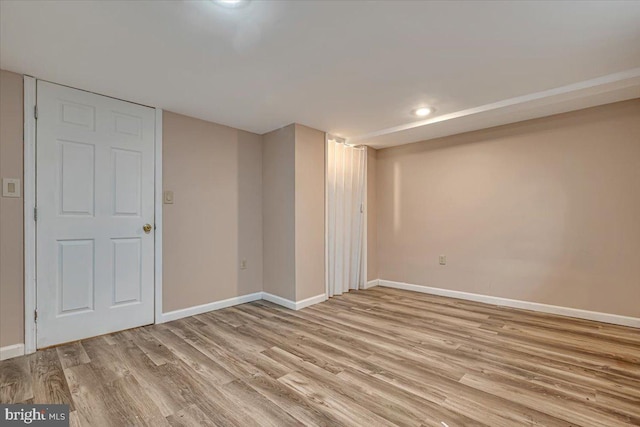 basement featuring light wood-type flooring