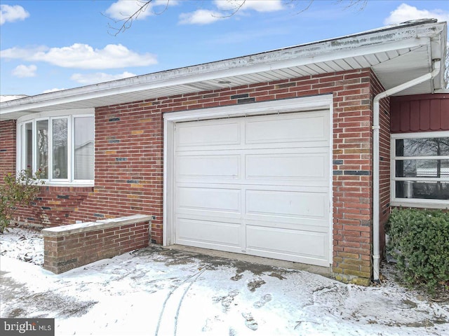 view of snow covered garage