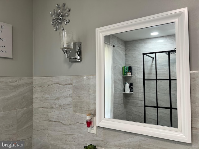 bathroom with tiled shower