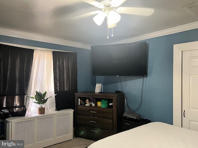 bedroom with radiator, crown molding, and ceiling fan