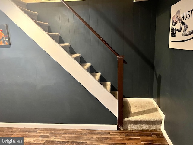 stairs with wood-type flooring