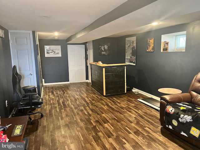 sitting room featuring dark wood-type flooring