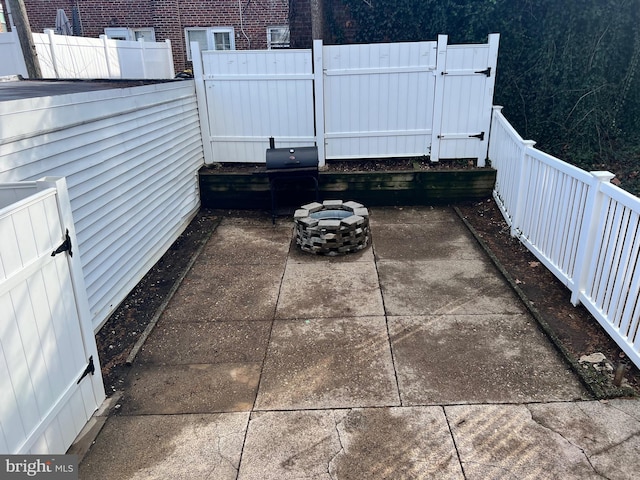 view of patio / terrace with grilling area and an outdoor fire pit