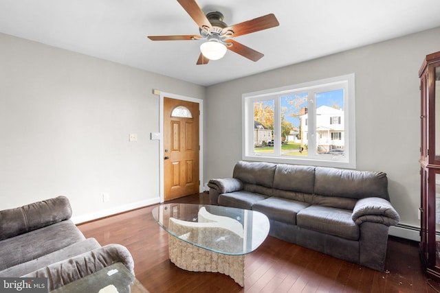 living room featuring dark hardwood / wood-style flooring and ceiling fan