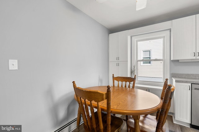 dining area with hardwood / wood-style flooring