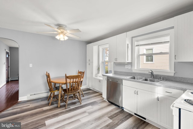 kitchen featuring stainless steel dishwasher, sink, a wealth of natural light, and light hardwood / wood-style flooring