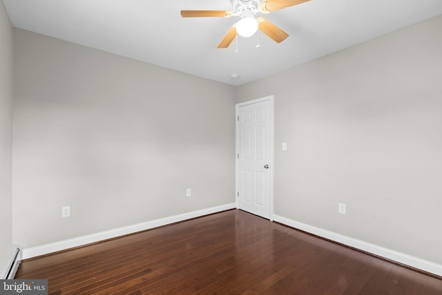 empty room featuring baseboard heating, dark wood-type flooring, and ceiling fan