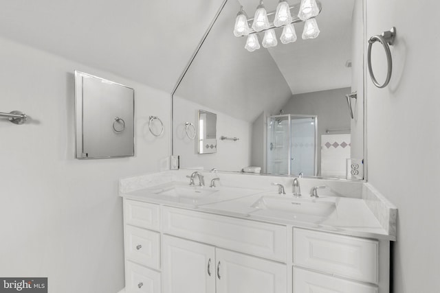 bathroom featuring vanity, an enclosed shower, and lofted ceiling