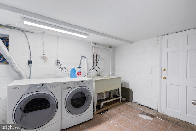 laundry area with washing machine and clothes dryer