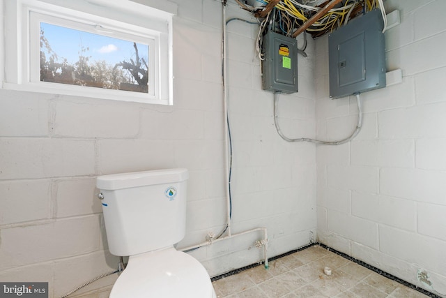 bathroom with toilet and electric panel