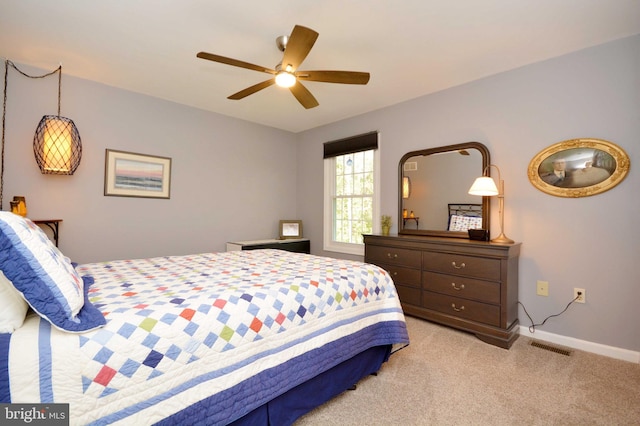 bedroom with light colored carpet and ceiling fan