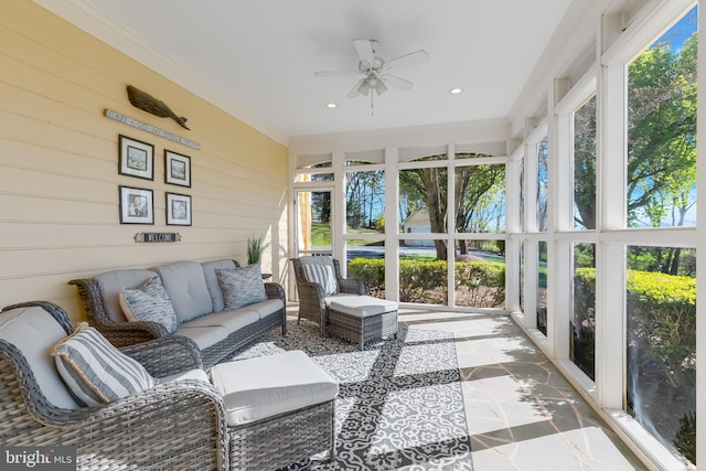 sunroom / solarium featuring ceiling fan