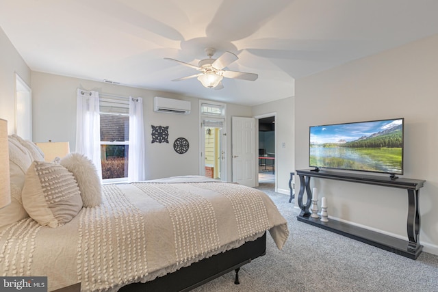 bedroom with ceiling fan, an AC wall unit, and carpet floors