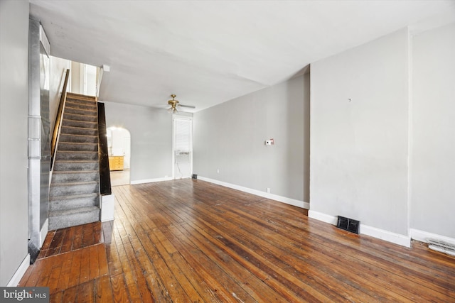 unfurnished living room featuring hardwood / wood-style flooring and ceiling fan