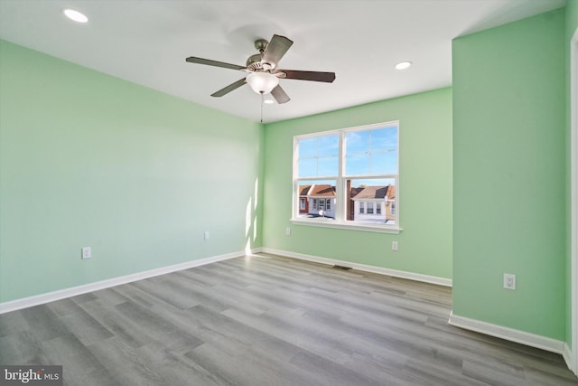 unfurnished room with light hardwood / wood-style floors and ceiling fan