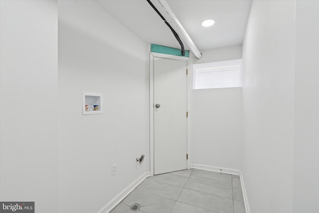 laundry room with hookup for a washing machine and light tile patterned floors