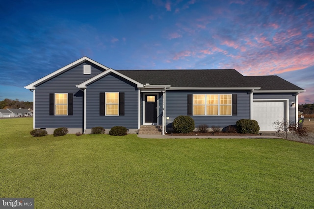 single story home with a yard and a garage