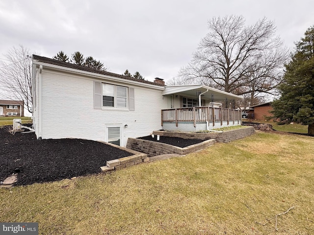 back of house with a lawn and a porch