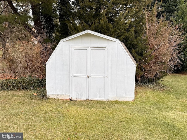 view of outbuilding with a lawn