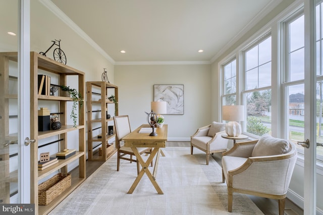 office area with light wood-type flooring, ornamental molding, and french doors