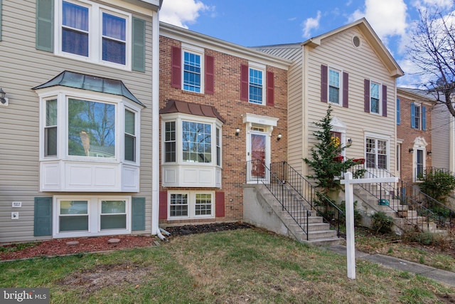 view of property featuring a front yard