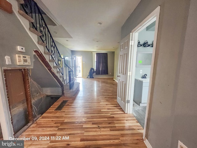 hall with wood-type flooring