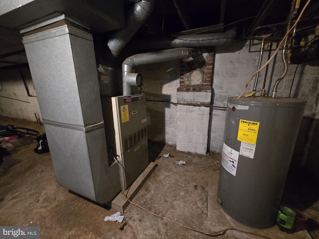 utility room featuring heating unit and water heater