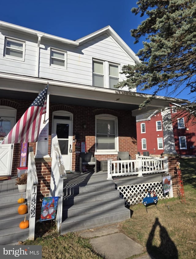 multi unit property featuring covered porch