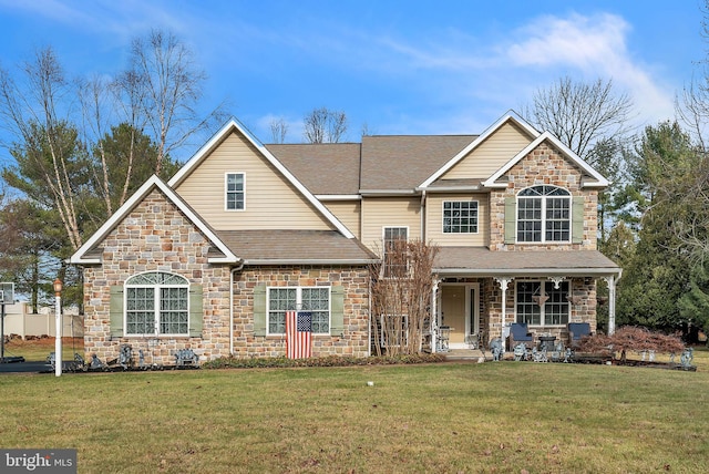 view of front of home with a front yard and a porch