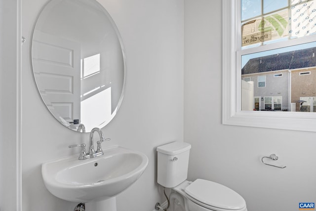 bathroom featuring toilet and sink