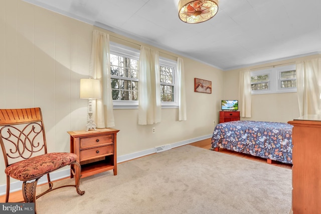 bedroom with carpet flooring and ornamental molding