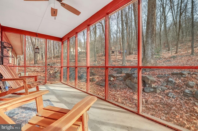 sunroom / solarium featuring ceiling fan