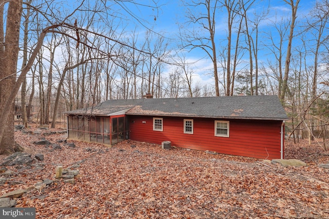 back of house with a sunroom and central air condition unit