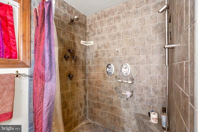 bathroom with a shower with shower curtain