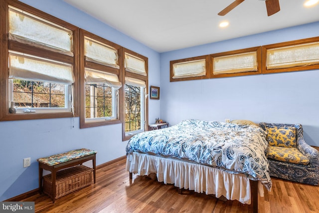 bedroom featuring hardwood / wood-style floors and ceiling fan