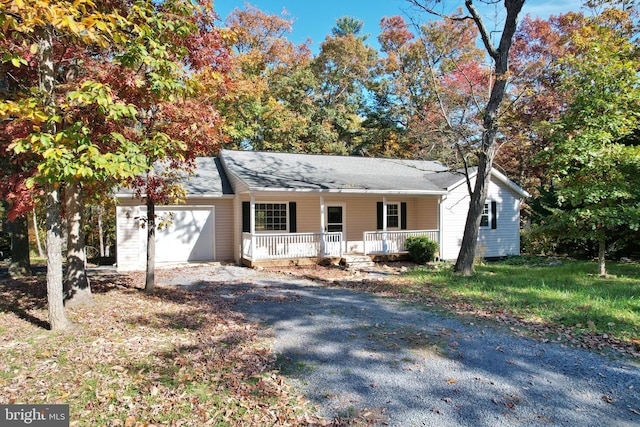 ranch-style house with a porch and a garage