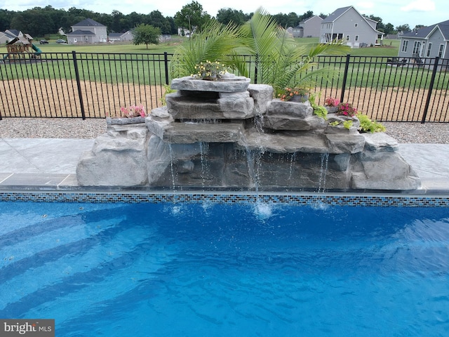 view of pool featuring pool water feature