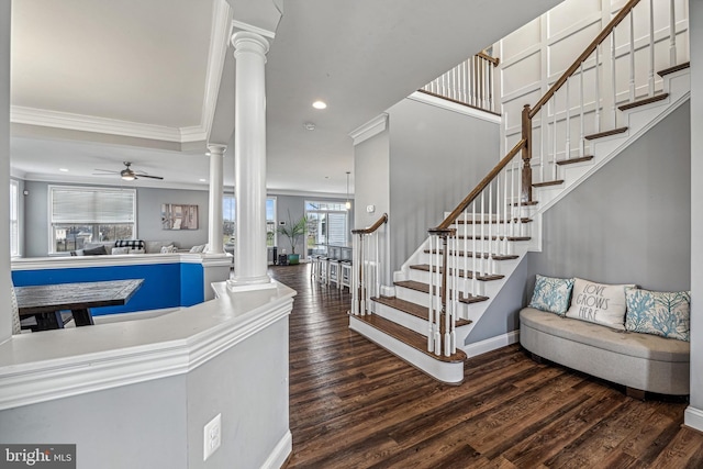 interior space featuring hardwood / wood-style flooring, ceiling fan, and ornamental molding