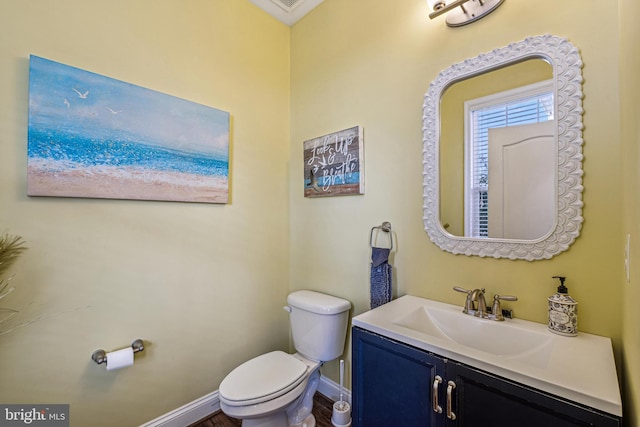 bathroom featuring vanity and toilet