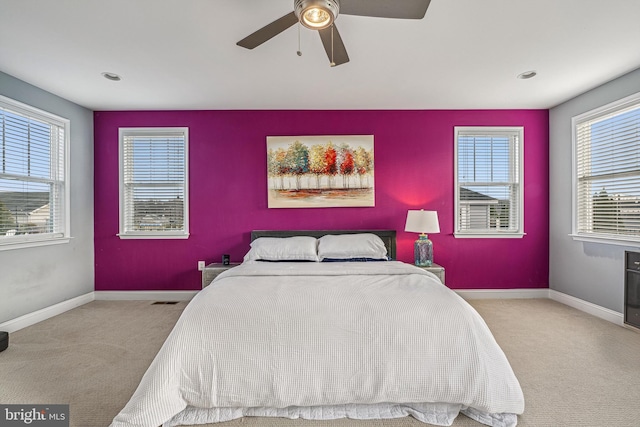 bedroom featuring ceiling fan and light colored carpet