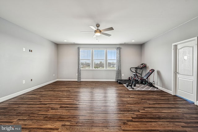 unfurnished room with dark hardwood / wood-style floors and ceiling fan