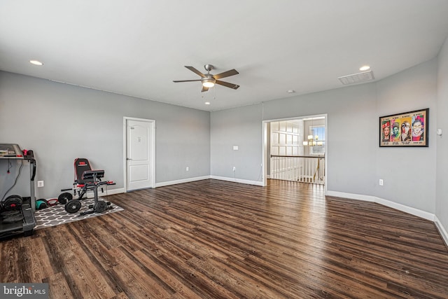 interior space with ceiling fan and dark wood-type flooring