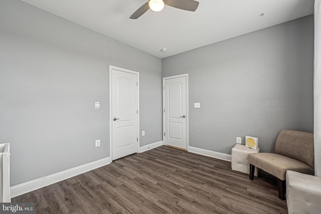 unfurnished room featuring ceiling fan and dark hardwood / wood-style floors