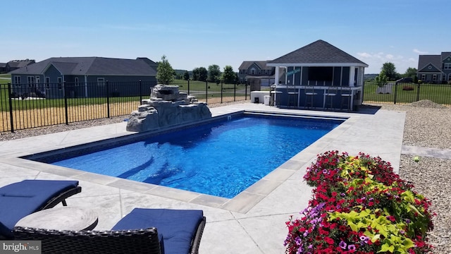 view of swimming pool with a patio