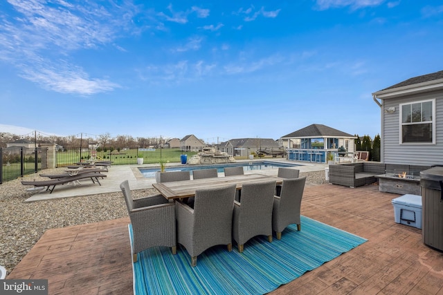 view of patio featuring a fenced in pool and an outdoor structure