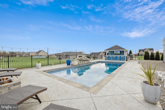 view of swimming pool with a patio area and a yard