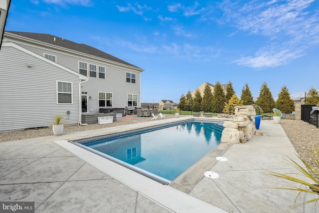 view of pool featuring a patio